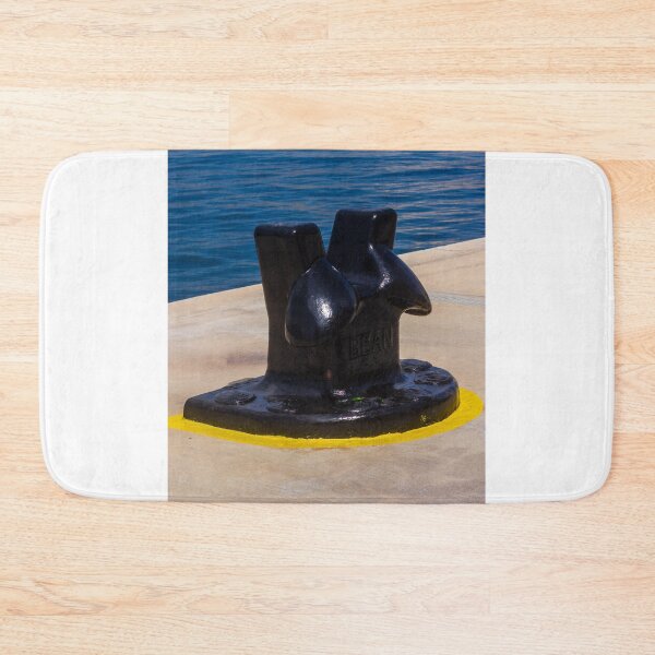 Item preview, Black Mooring Bollard On Concrete Pier By Blue Harbor Water With Yellow Painted Base designed and sold by Nmallia.