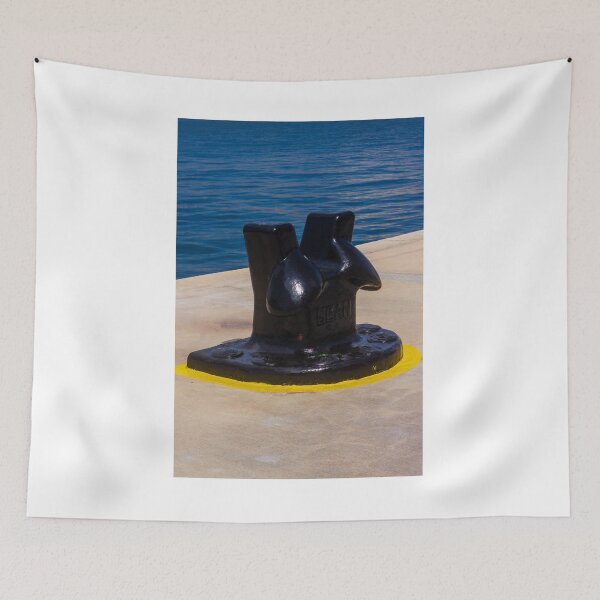 Item preview, Black Mooring Bollard On Concrete Pier By Blue Harbor Water With Yellow Painted Base designed and sold by Nmallia.