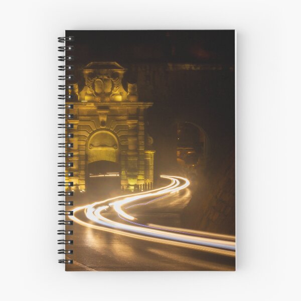 Item preview, Long Exposure Light Trails Curving Past a Historic Stone Gate and Archway at Night designed and sold by Nmallia.