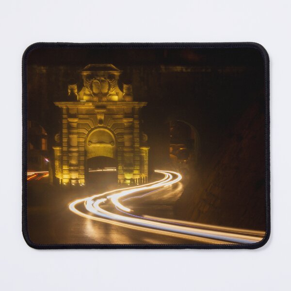 Item preview, Long Exposure Light Trails Curving Past a Historic Stone Gate and Archway at Night designed and sold by Nmallia.