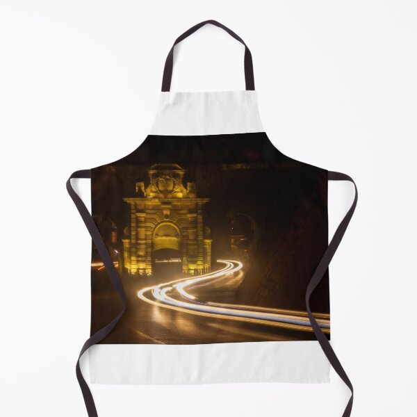Item preview, Long Exposure Light Trails Curving Past a Historic Stone Gate and Archway at Night designed and sold by Nmallia.