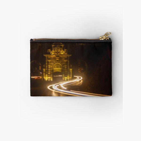 Item preview, Long Exposure Light Trails Curving Past a Historic Stone Gate and Archway at Night designed and sold by Nmallia.