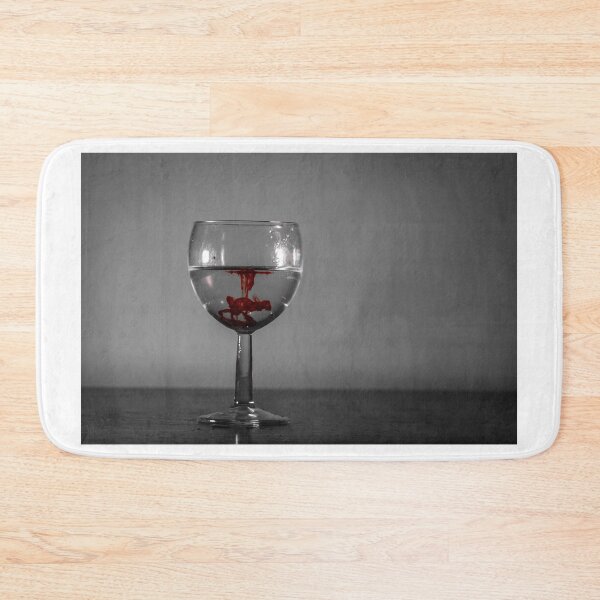 Item preview, Red Ink Droplet In Wine Glass Of Water With Monochrome Background And Dramatic Contrast designed and sold by Nmallia.