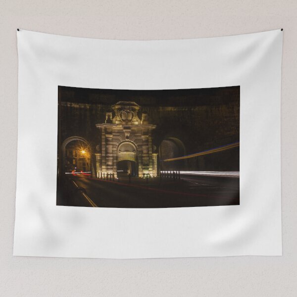 Item preview, Historic Stone Gate At Night With Light Trails And Long Exposure Traffic On City Street designed and sold by Nmallia.