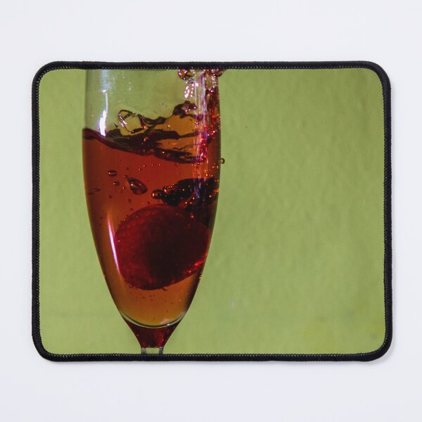 Item preview, Red Strawberry Splash in Champagne Glass With Dramatic Liquid Motion on Green Background designed and sold by Nmallia.