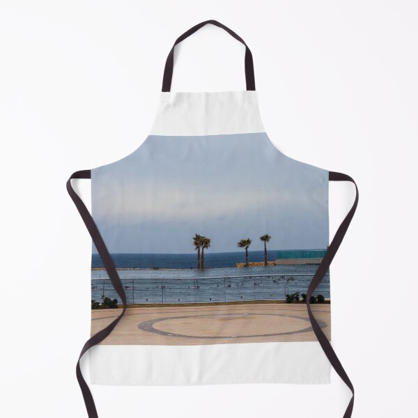 Item preview, Empty Coastal Promenade With Palm Trees Overlooking Ocean and Calm Waterfront on Cloudy Day designed and sold by Nmallia.