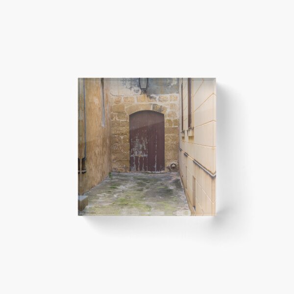 Item preview, Old Stone Alley With Weathered Wooden Door And Lantern in Narrow Rustic Passage designed and sold by Nmallia.
