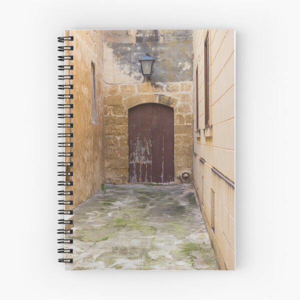 Item preview, Old Stone Alley With Weathered Wooden Door And Lantern in Narrow Rustic Passage designed and sold by Nmallia.