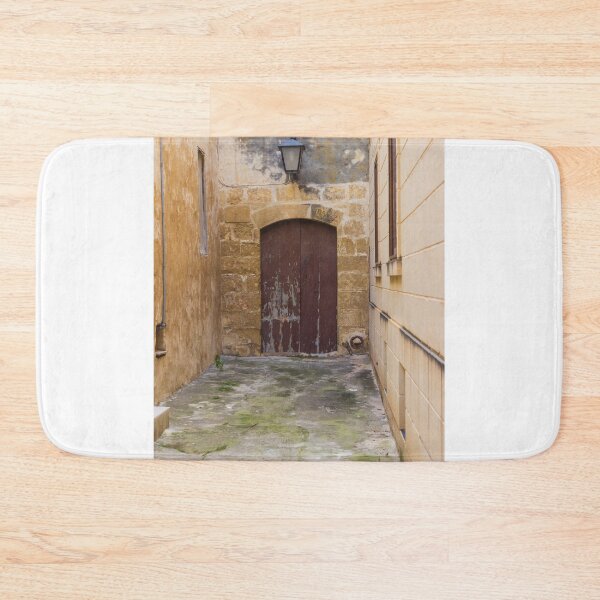Item preview, Old Stone Alley With Weathered Wooden Door And Lantern in Narrow Rustic Passage designed and sold by Nmallia.