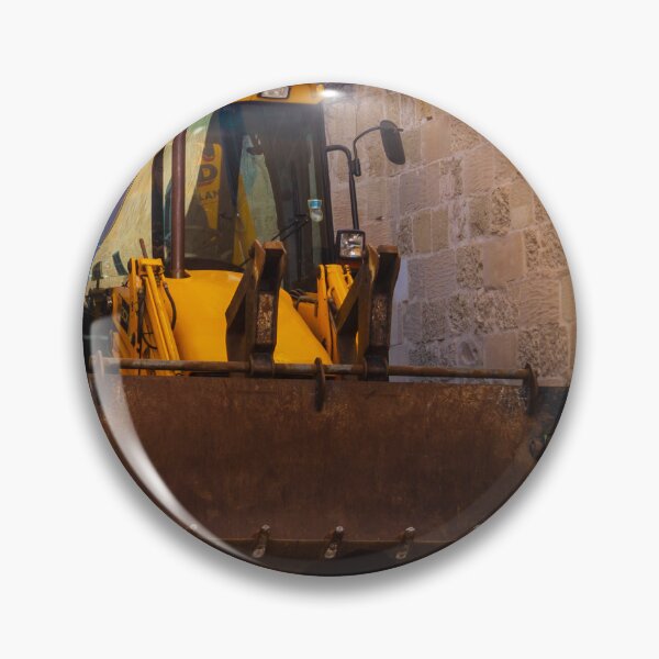 Item preview, Backhoe Loader Parked In Narrow Alley Between Old Stone Walls On Urban Construction Site designed and sold by Nmallia.