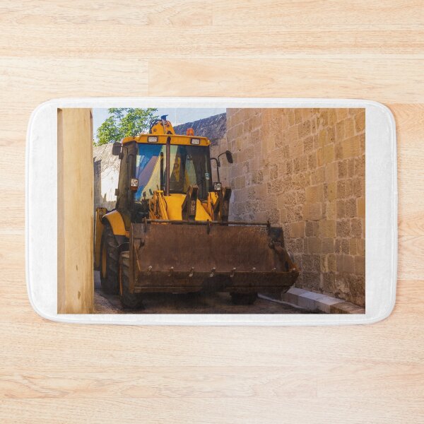 Item preview, Backhoe Loader Parked In Narrow Alley Between Old Stone Walls On Urban Construction Site designed and sold by Nmallia.