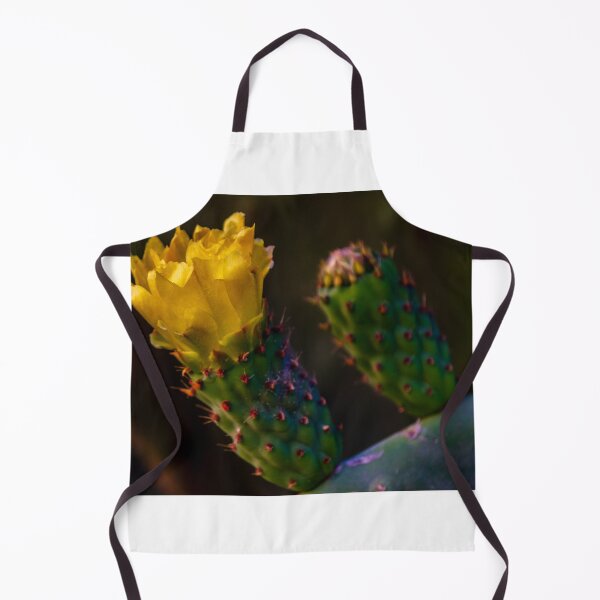 Item preview, Yellow Prickly Pear Cactus Flower Close-Up On Green Opuntia Pad In Soft Desert Light designed and sold by Nmallia.