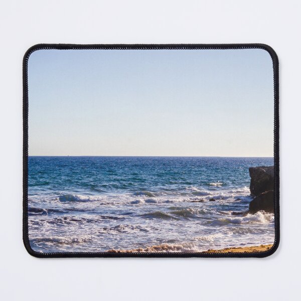 Item preview, Sunlit Rocky Coastline With Waves Crashing On Sandy Beach At Late Afternoon Horizon designed and sold by Nmallia.