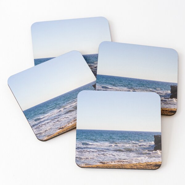 Item preview, Sunlit Rocky Coastline With Waves Crashing On Sandy Beach At Late Afternoon Horizon designed and sold by Nmallia.