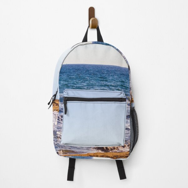 Item preview, Sunlit Rocky Coastline With Waves Crashing On Sandy Beach At Late Afternoon Horizon designed and sold by Nmallia.