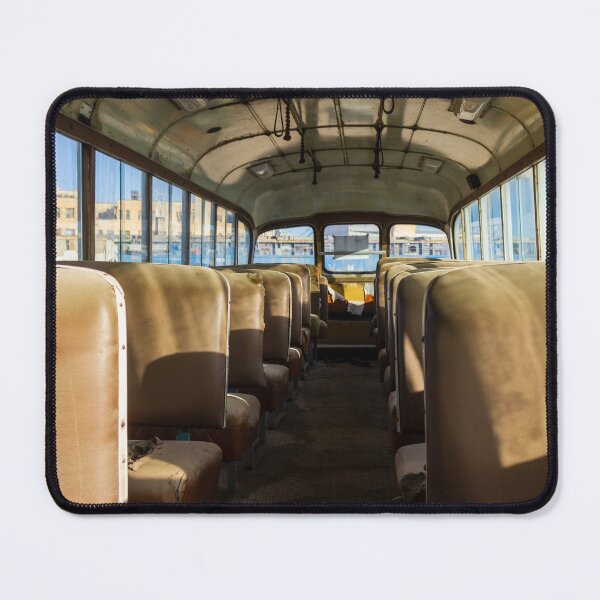 Item preview, Abandoned School Bus Interior With Empty Sunlit Seats and Worn Vintage Upholstery Evoking Nostalgia designed and sold by Nmallia.