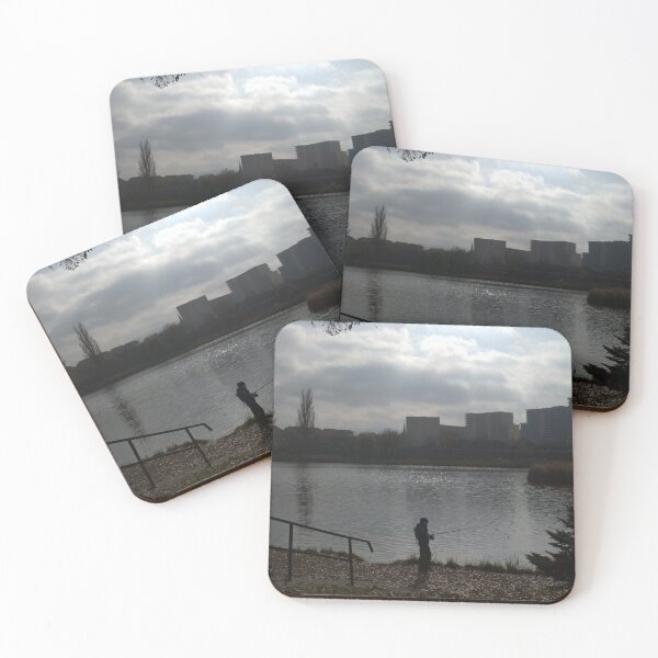 Item preview, Silhouette of a man fishing in a lake near an urban area on a cloudy day. designed and sold by FlorinWorks.