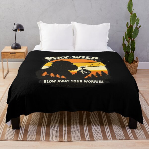Item preview, Stay Wild Blow Away Your Worries Bigfoot Retro Vintage Shirt, Bigfoot Blowing Dandelion designed and sold by VibeOffline Studio.
