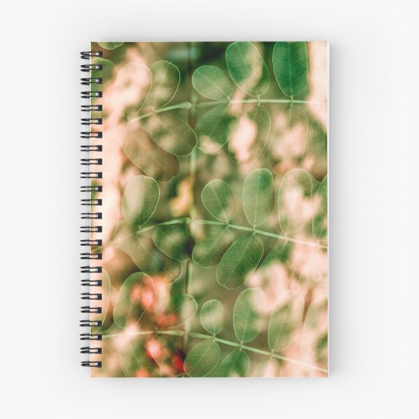 Item preview, A delicate multiple exposure of small, rounded green leaves layered over warm, peach-toned foliage. designed and sold by AbulailArt.