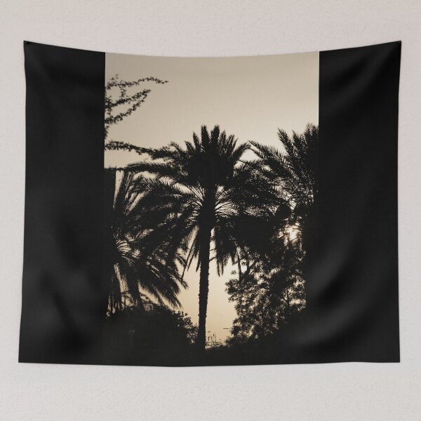 Item preview, Silhouette of Palm Trees Against a Soft Sunset Sky in the United Arab Emirates designed and sold by AbulailArt.