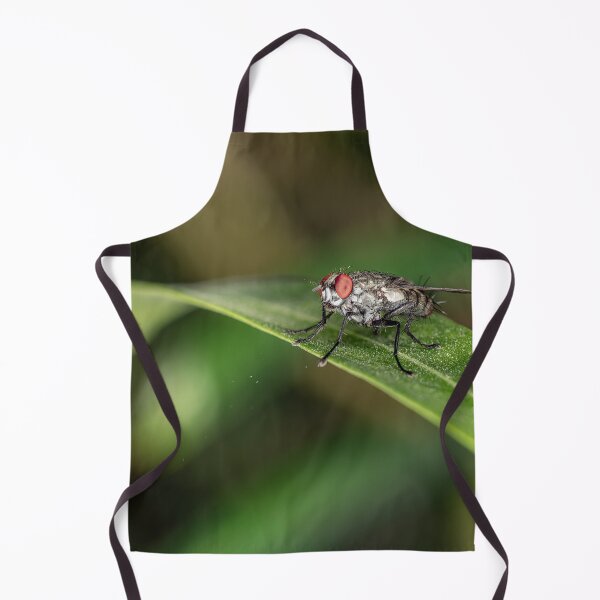 Item preview, Macro Shot of a Common Housefly with Red Eyes Resting on a Green Leaf designed and sold by AbulailArt.