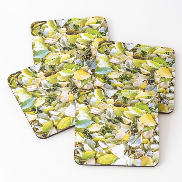 Item preview, Close-up view of fallen autumn leaves in shades of yellow and green covering a grassy ground designed and sold by AbulailArt.