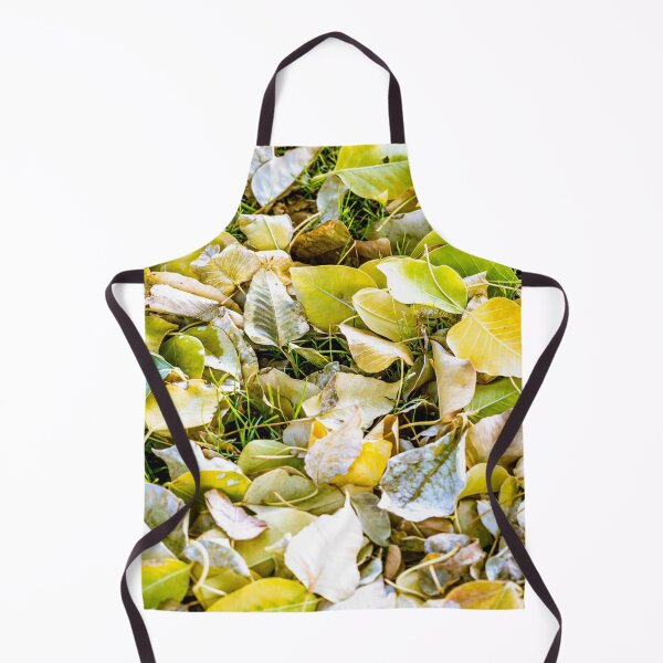Item preview, Close-up view of fallen autumn leaves in shades of yellow and green covering a grassy ground designed and sold by AbulailArt.
