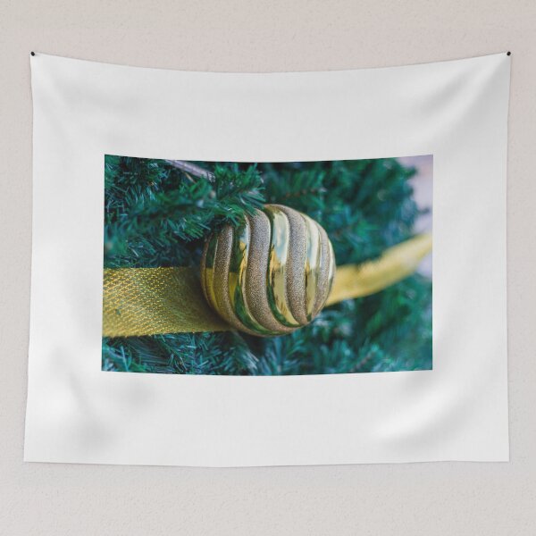 Item preview, Gold Christmas Ornament With Ribbon on Green Tree Closeup Holiday Decoration designed and sold by Nmallia.
