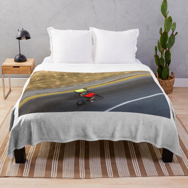 Item preview, Two Road Cyclists Riding Together Along Curved Urban Street in Motion designed and sold by Nmallia.