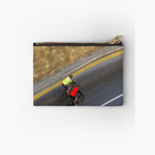 Item preview, Two Road Cyclists Riding Together Along Curved Urban Street in Motion designed and sold by Nmallia.