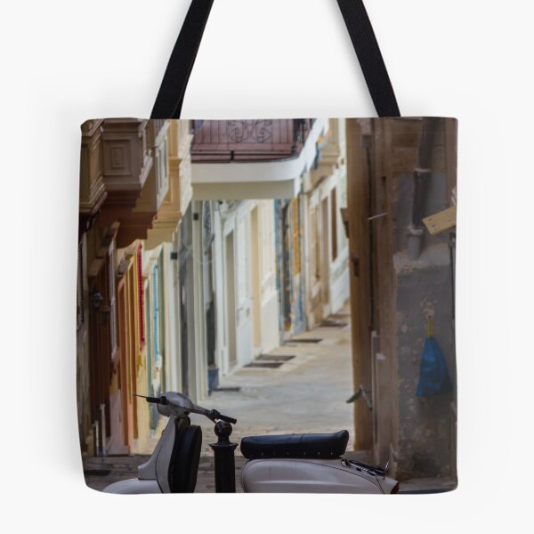 Item preview, Vintage White Scooter Parked in Narrow Mediterranean Alley With Colorful Balconies and Quiet Atmosphere designed and sold by Nmallia.