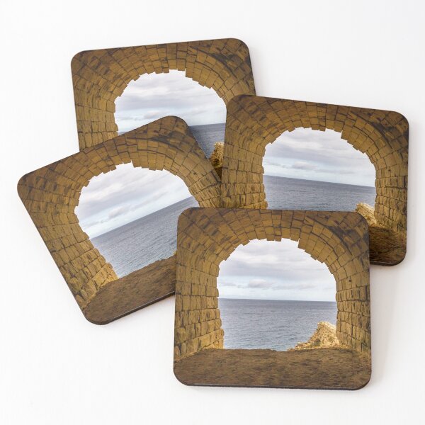 Item preview, Stone Arch Tunnel Framing A Calm Ocean View Over Rocky Coastal Cliff In Golden Light designed and sold by Nmallia.