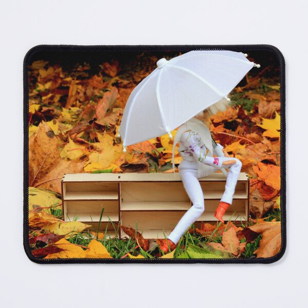 Item preview, Doll with umbrella siting on bookcase with the background of yellow orange autumn leaves designed and sold by Lenasminiland.