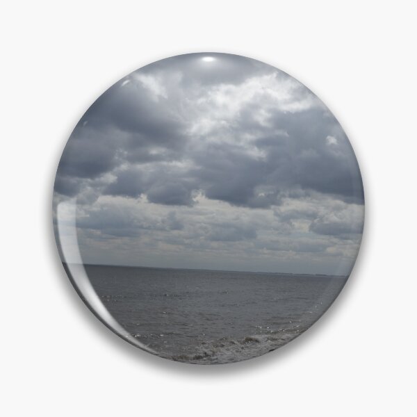 Item preview, pebbled beach  with threatening clouds designed and sold by Stephen Green Creative Photography.
