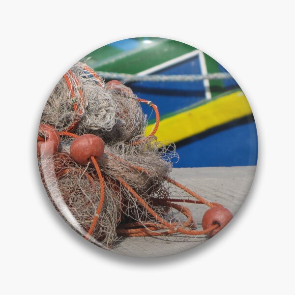 Item preview, Fishing Net With Red Floats On Harbor Dock In Front Of Colorful Fishing Boats designed and sold by Nmallia.