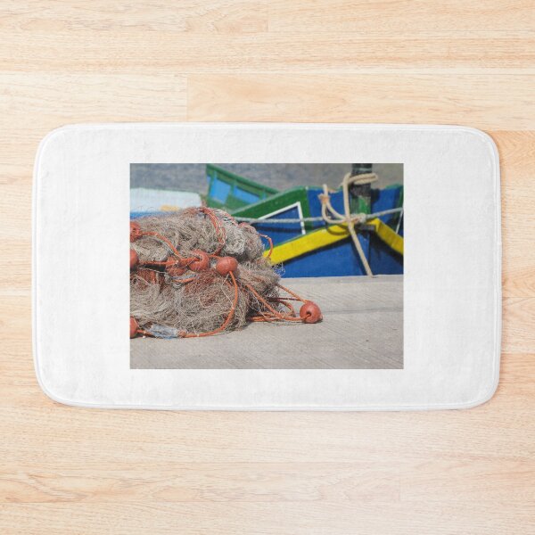 Item preview, Fishing Net With Red Floats On Harbor Dock In Front Of Colorful Fishing Boats designed and sold by Nmallia.
