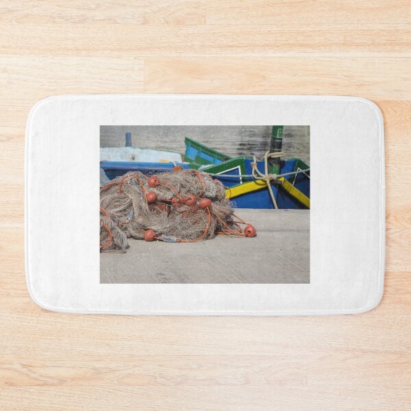 Item preview, Fishing Net With Red Floats On Harbor Dock In Front Of Colorful Fishing Boats designed and sold by Nmallia.