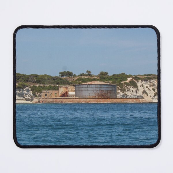Item preview, Rusted Industrial Storage Tank on Coastal Pier With Cliffs and Blue Sea Horizon designed and sold by Nmallia.