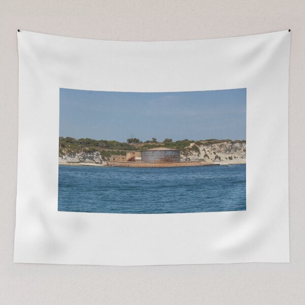 Item preview, Rusted Industrial Storage Tank on Coastal Pier With Cliffs and Blue Sea Horizon designed and sold by Nmallia.