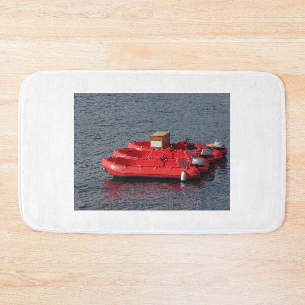 Item preview, Row Of Red Rental Boats Floating On Calm Blue Water Near A Marina For Summer Leisure designed and sold by Nmallia.
