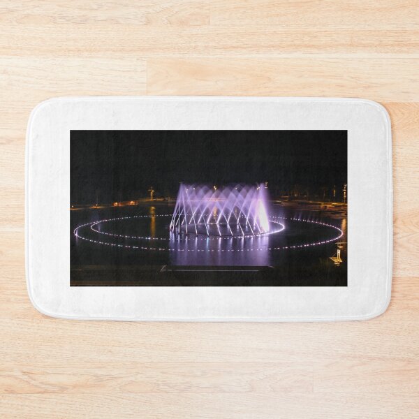 Item preview, Illuminated Circular Fountain Light Show Over Lake at Night With Water Jets and Reflections designed and sold by Nmallia.