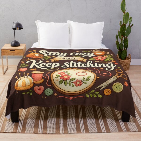 Item preview, Stay Cozy and Keep Stitching – Cozy Sewing & Embroidery Design designed and sold by blankTeeShirt.