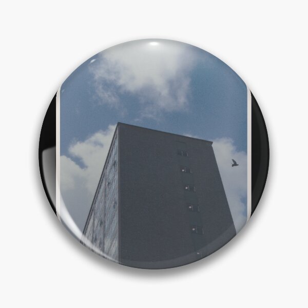 Item preview, bird swoops past a building on a day with a blue sky in glasgow (scotland) (may 2026) designed and sold by photosbykel.