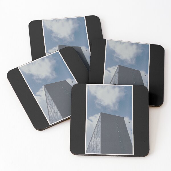 Item preview, bird swoops past a building on a day with a blue sky in glasgow (scotland) (may 2026) designed and sold by photosbykel.
