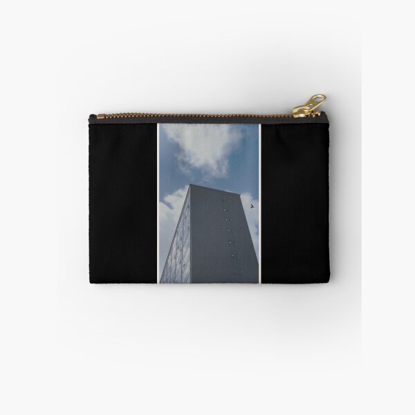 Item preview, bird swoops past a building on a day with a blue sky in glasgow (scotland) (may 2026) designed and sold by photosbykel.