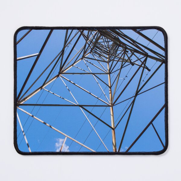 Item preview, A Tall Metal Electric Grid Tower Rises Against A Clear Blue Sky, Emphasizing Its Height And Structure designed and sold by Shonti.