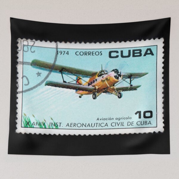 Item preview, Cuban postage stamp featuring airplane. Agricultural aviation. Vintage stamp with image of airplane isolated on black. Stamp depicting aircraft for agricultural activities designed and sold by Decoriolus.