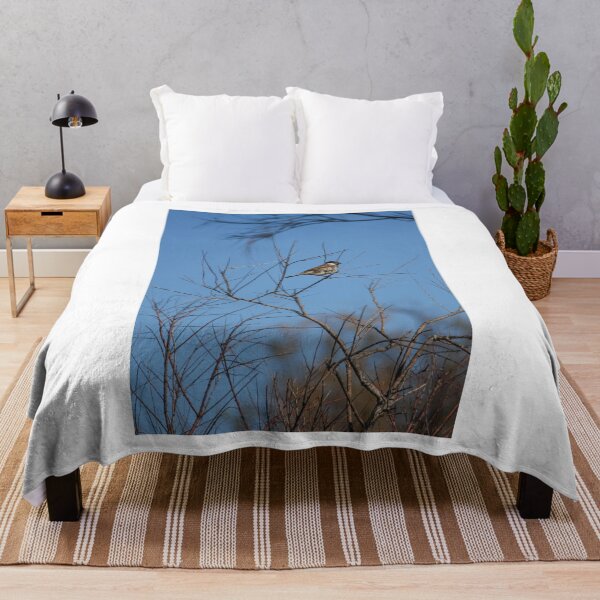 Item preview, Sparrow Perched on Bare Branches Against A Clear Blue Winter Sky, Calm Wildlife Moment designed and sold by Nmallia.