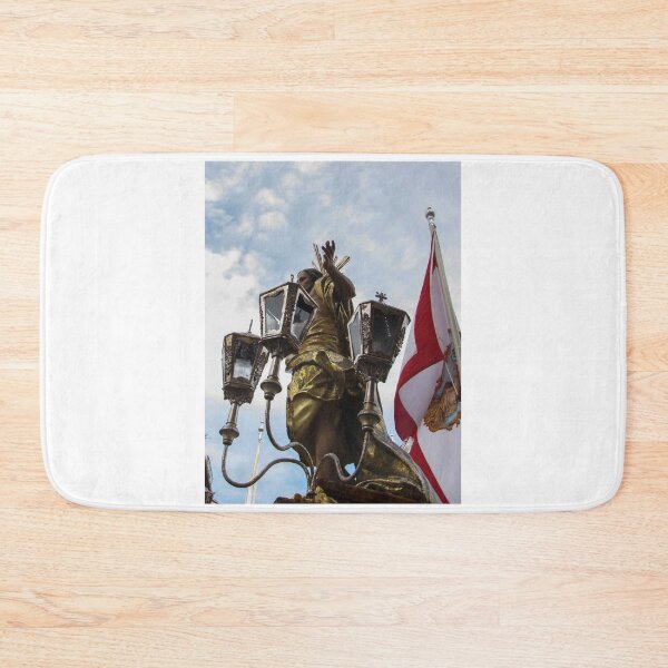 Item preview, Gilded Religious Statue With Lanterns and Flag During Outdoor Procession Under Cloudy Sky designed and sold by Nmallia.