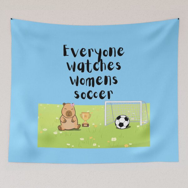 Item preview, Everyone watches womens soccer capybara with pink bow designed and sold by lesmakesdesigns.